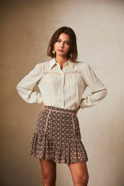 PRINTED SHORT SKIRT WITH RUFFLE HEM - BLACK