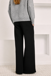 FLARED KNIT TROUSERS WITH POCKETS - BLACK