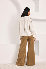 FLARED KNIT TROUSERS WITH POCKETS - CAMEL