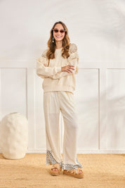 SUDADERA HOMBROS CALADOS Y FLECOS - CRUDO