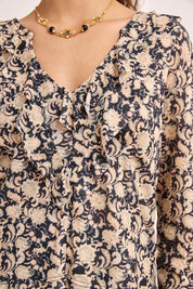 PRINTED TOP WITH RUFFLE NECKLINE - BLACK